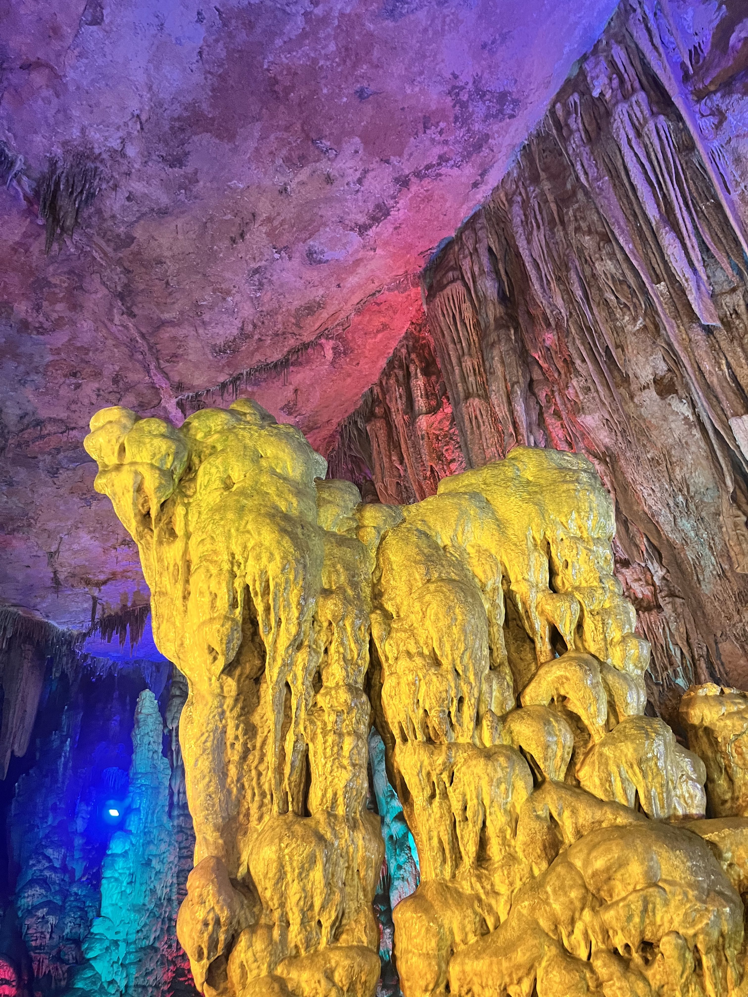 Calcium deposits in a cave in Hubei illuminated with yellow light.