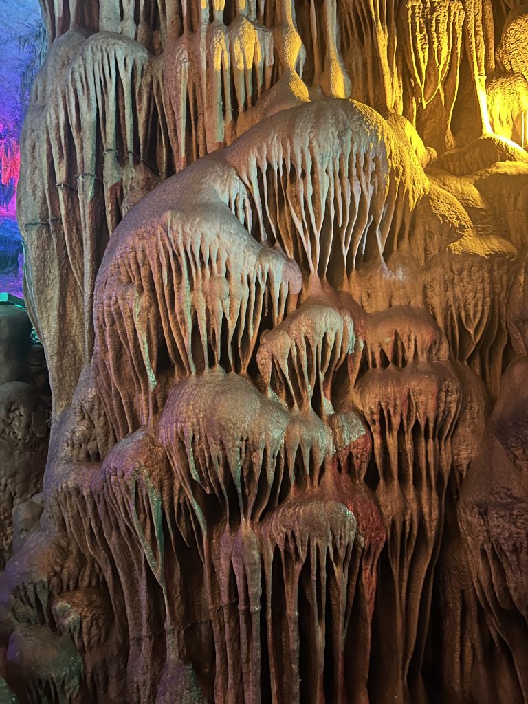 Calcium deposits in a cave in Hubei illuminated with purple light.