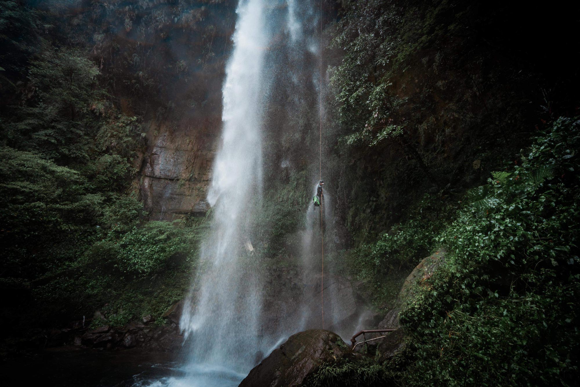 rappelling down a waterfall canyon in taiwan