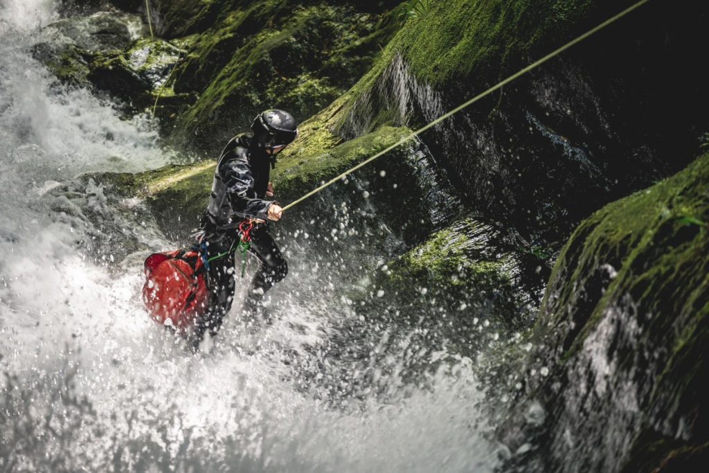 Client descending a canyon on a rope.