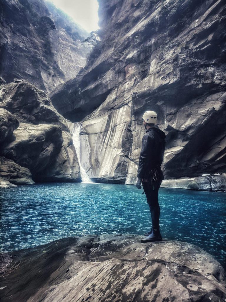 Massive canyon with deep pool and a waterfall slide.